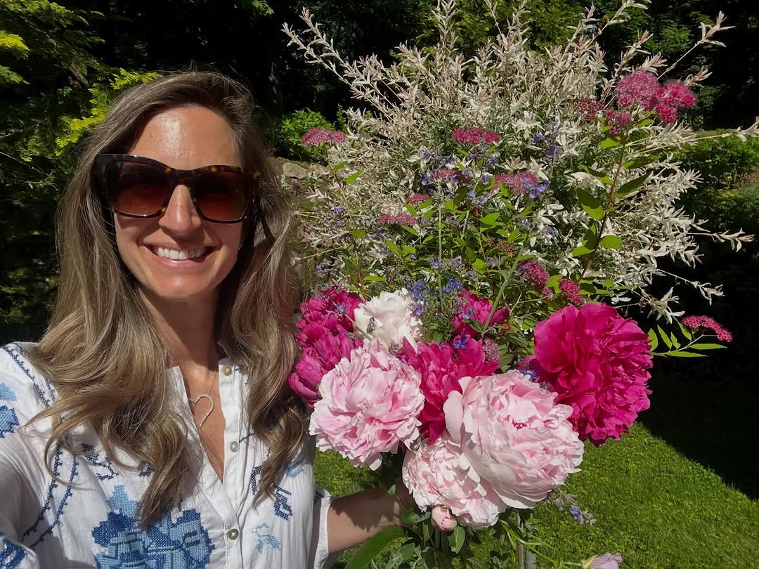 Elizabeth with an armful of peonies